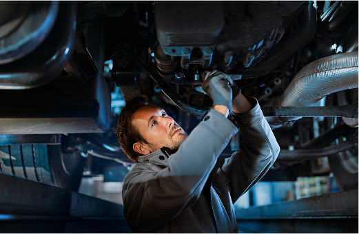 Mechanic under a vehicle